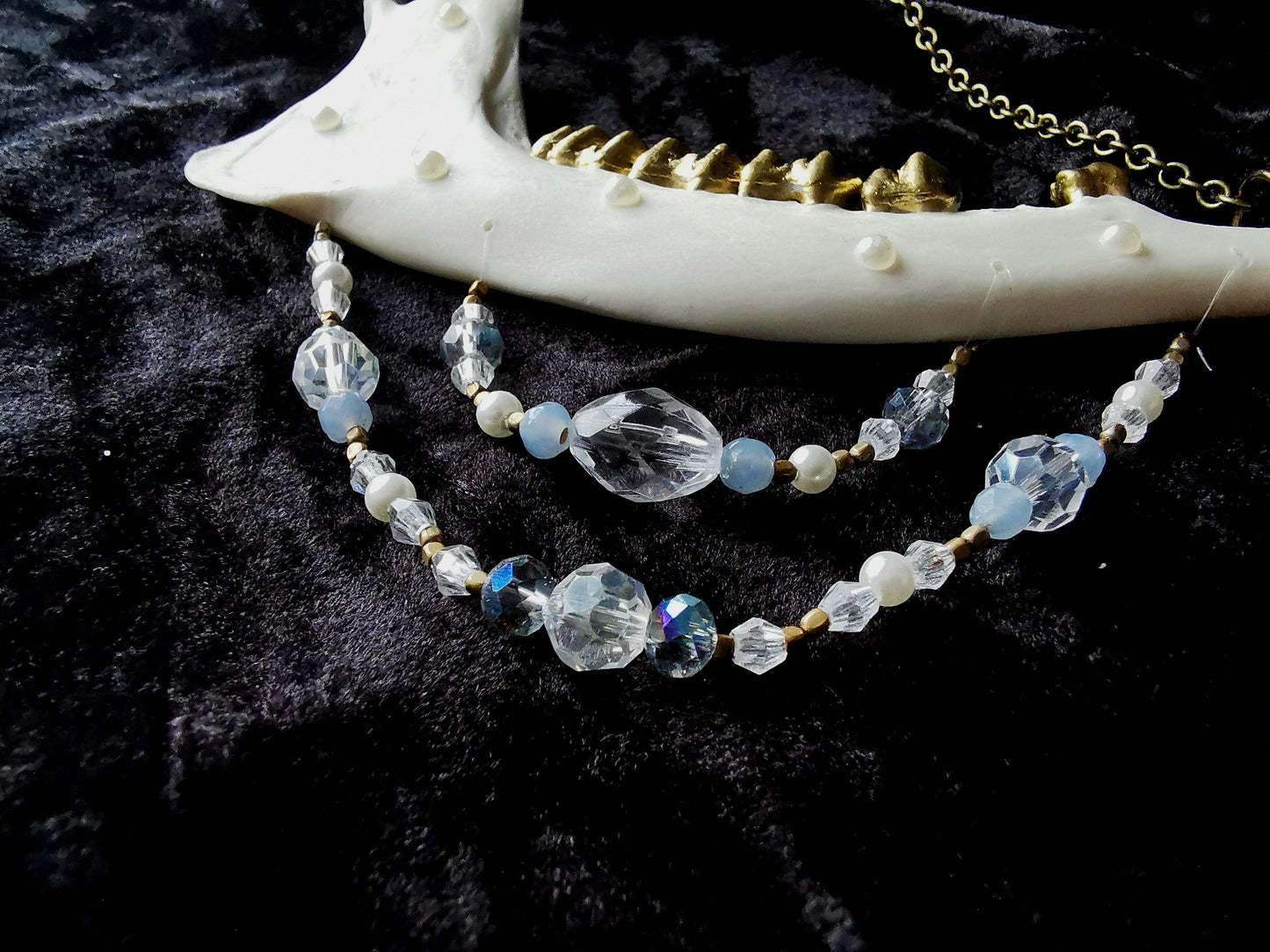 Deer jawbone wall hanger with clear and blue glass and crystal beads