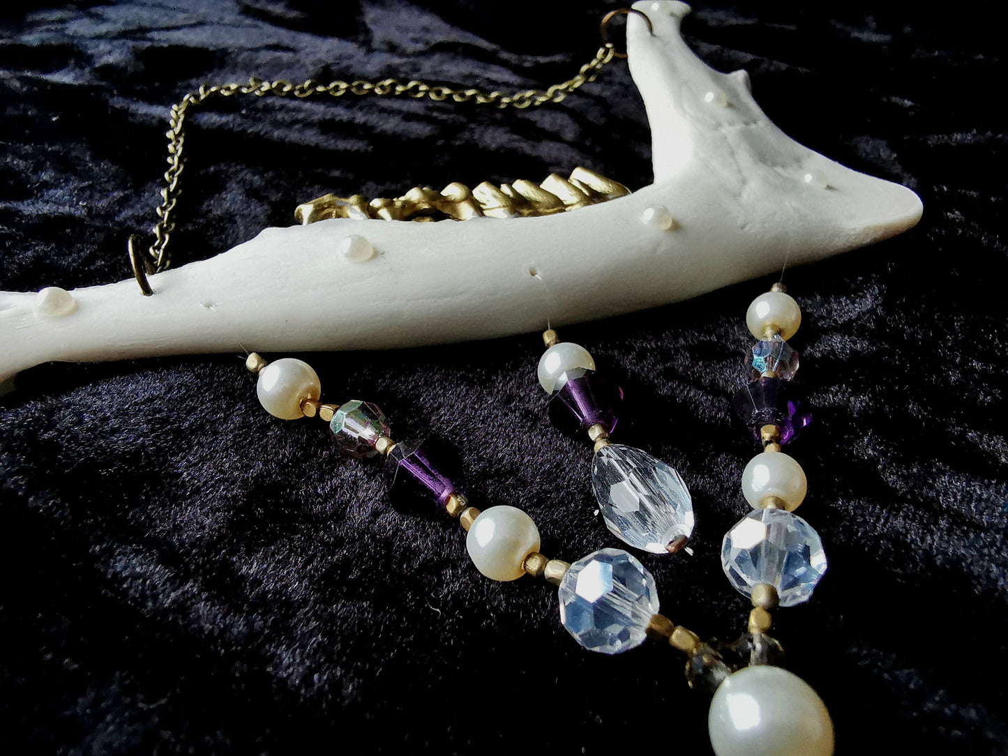 Deer jawbone wall hanger with pearl, clear and purple glass and crystal beads