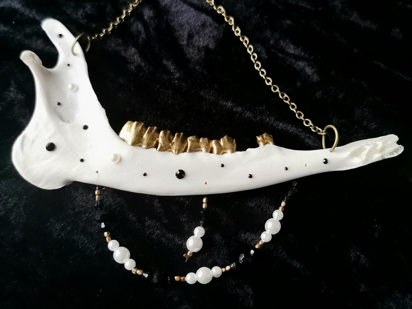 Deer jawbone wall hanger with pearl and black glass and crystal beads