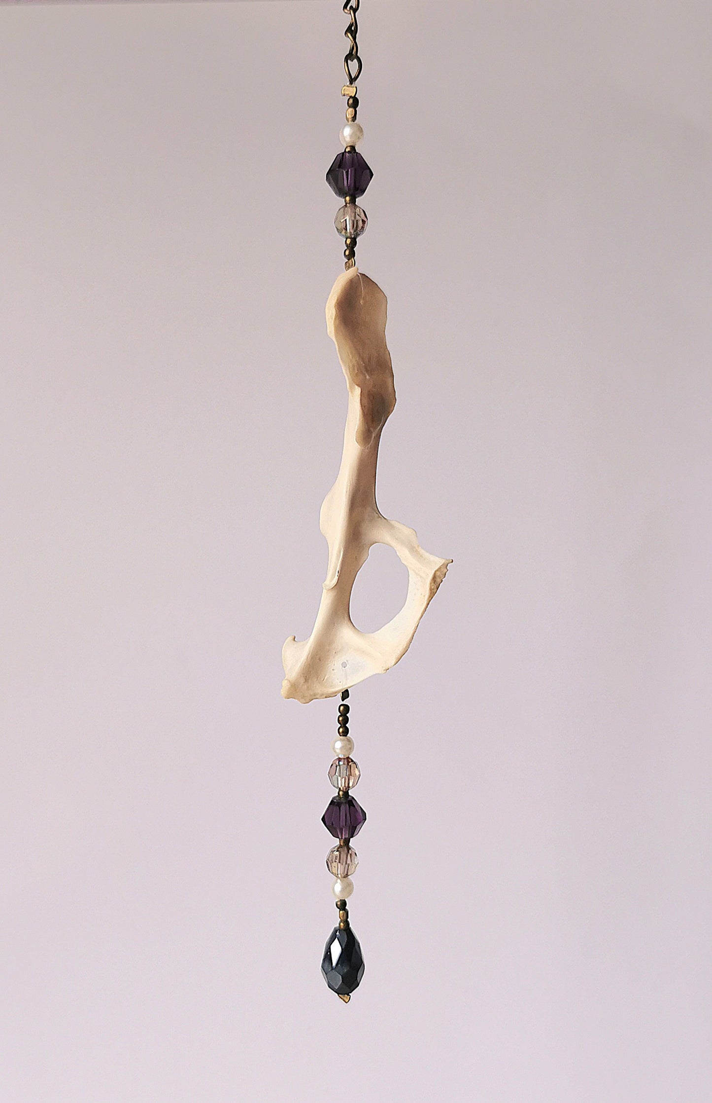Animal bone suncatcher with clear and purple beads