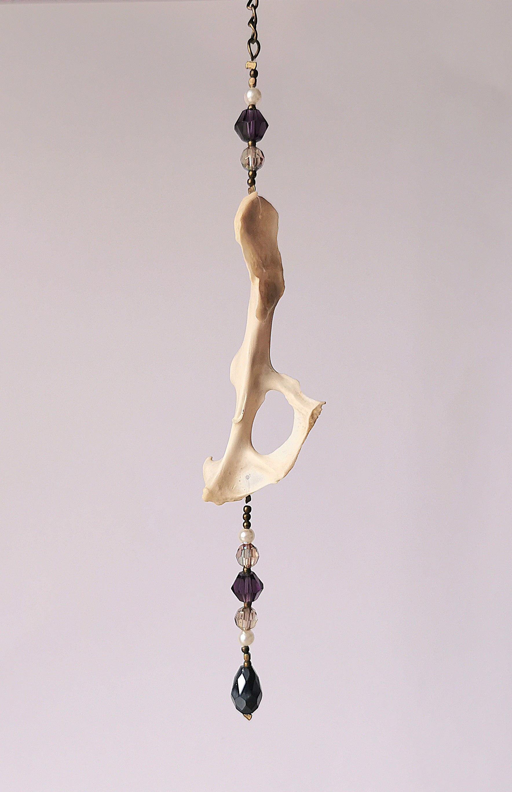 Animal bone suncatcher with clear and purple beads