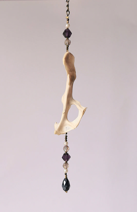 Animal bone suncatcher with clear and purple beads
