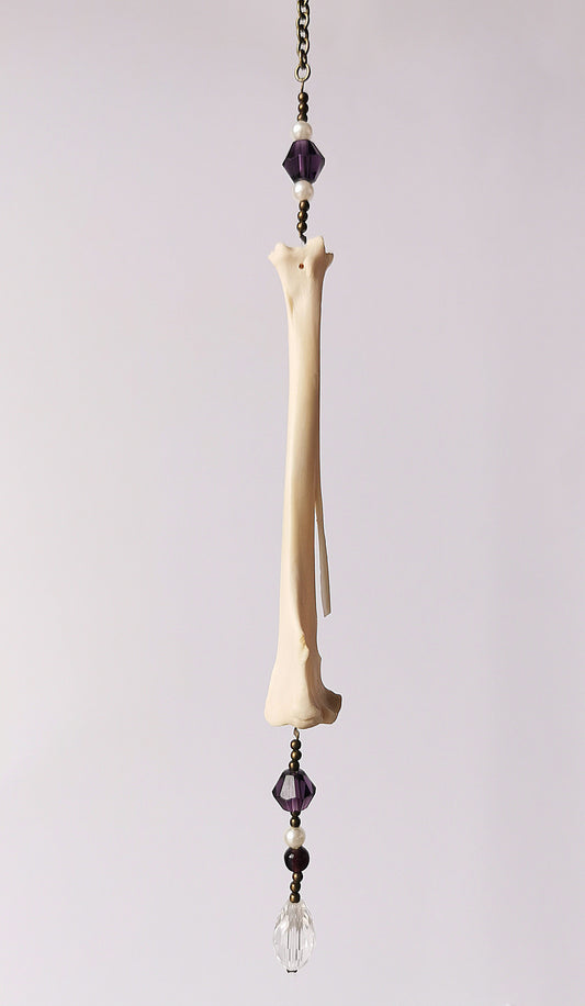 Animal bone suncatcher with pearl and purple beads