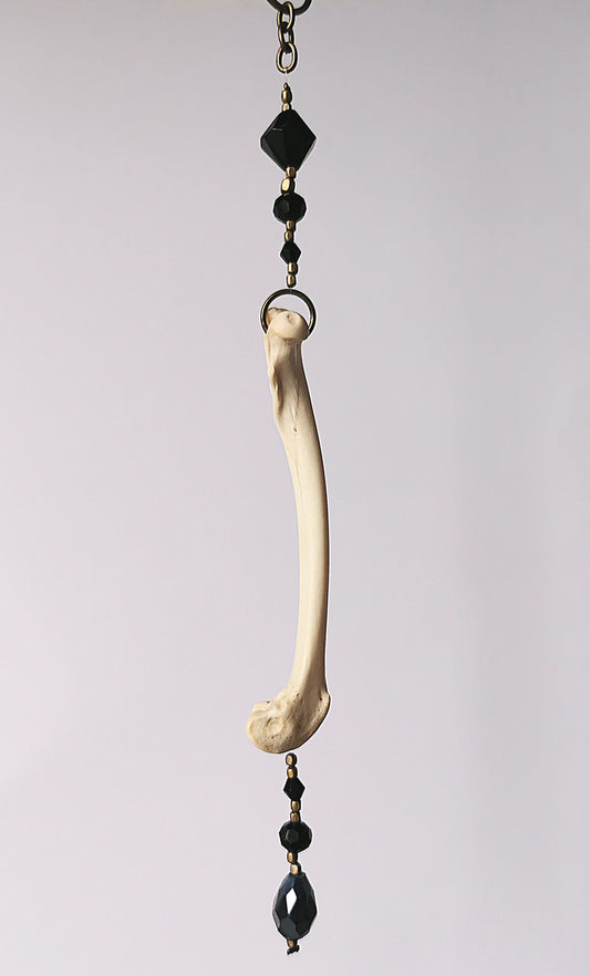 Animal bone suncatcher with black beads