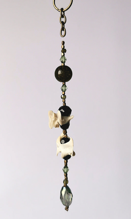 Animal bone suncatcher with green and black beads