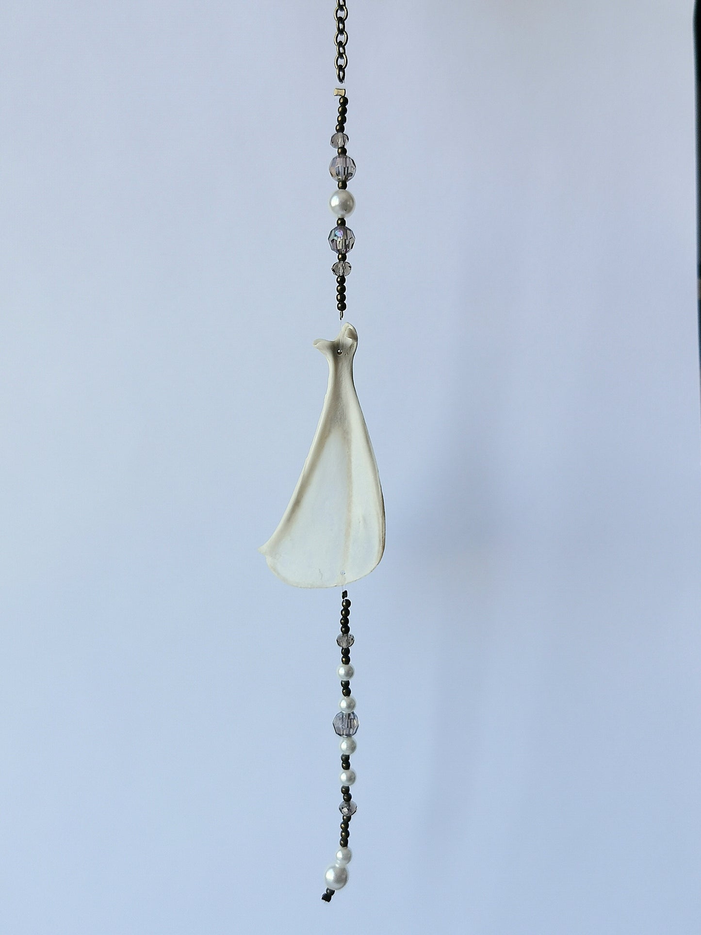 Animal bone suncatcher with grey and pearl beads