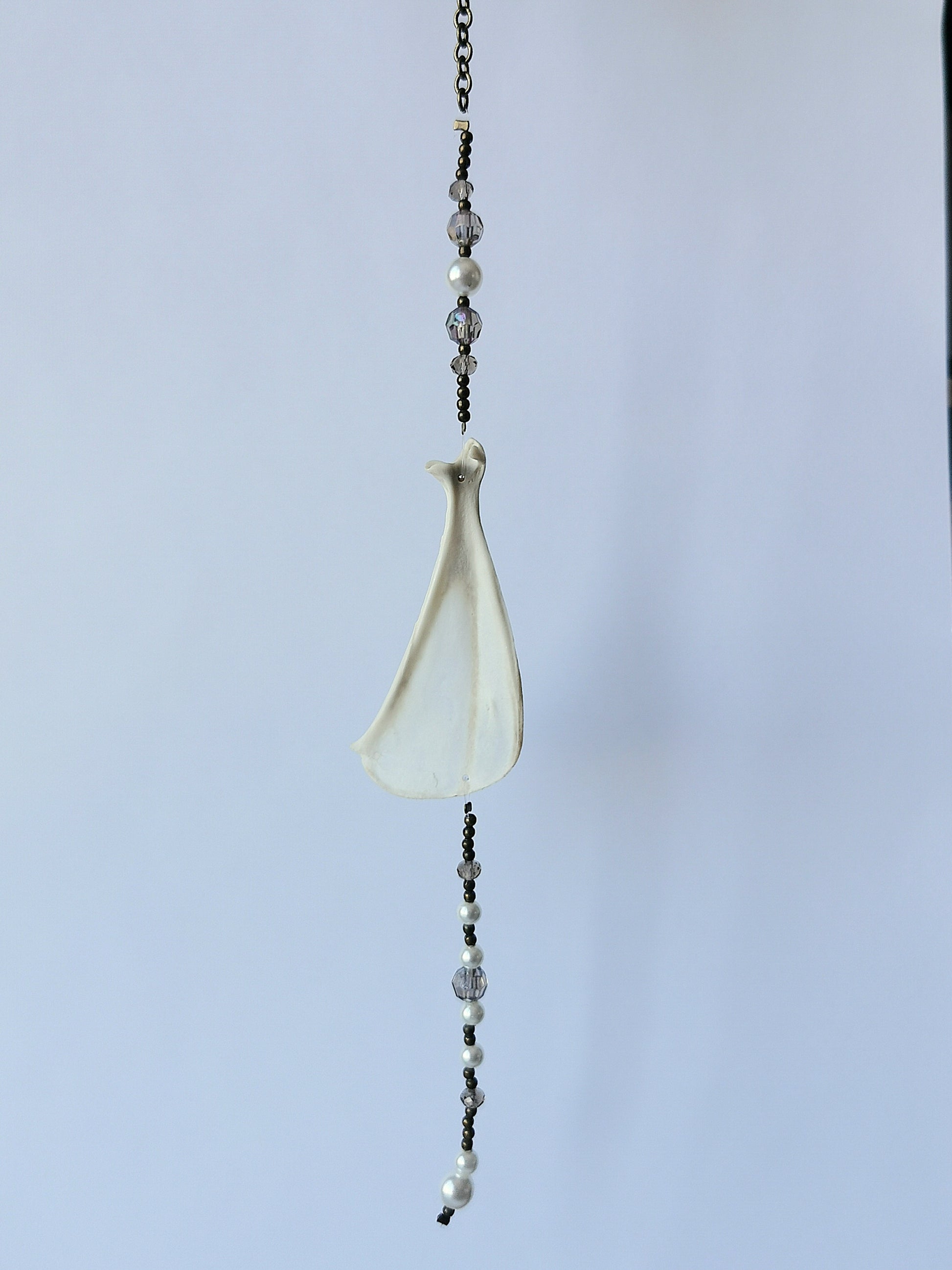 Animal bone suncatcher with grey and pearl beads