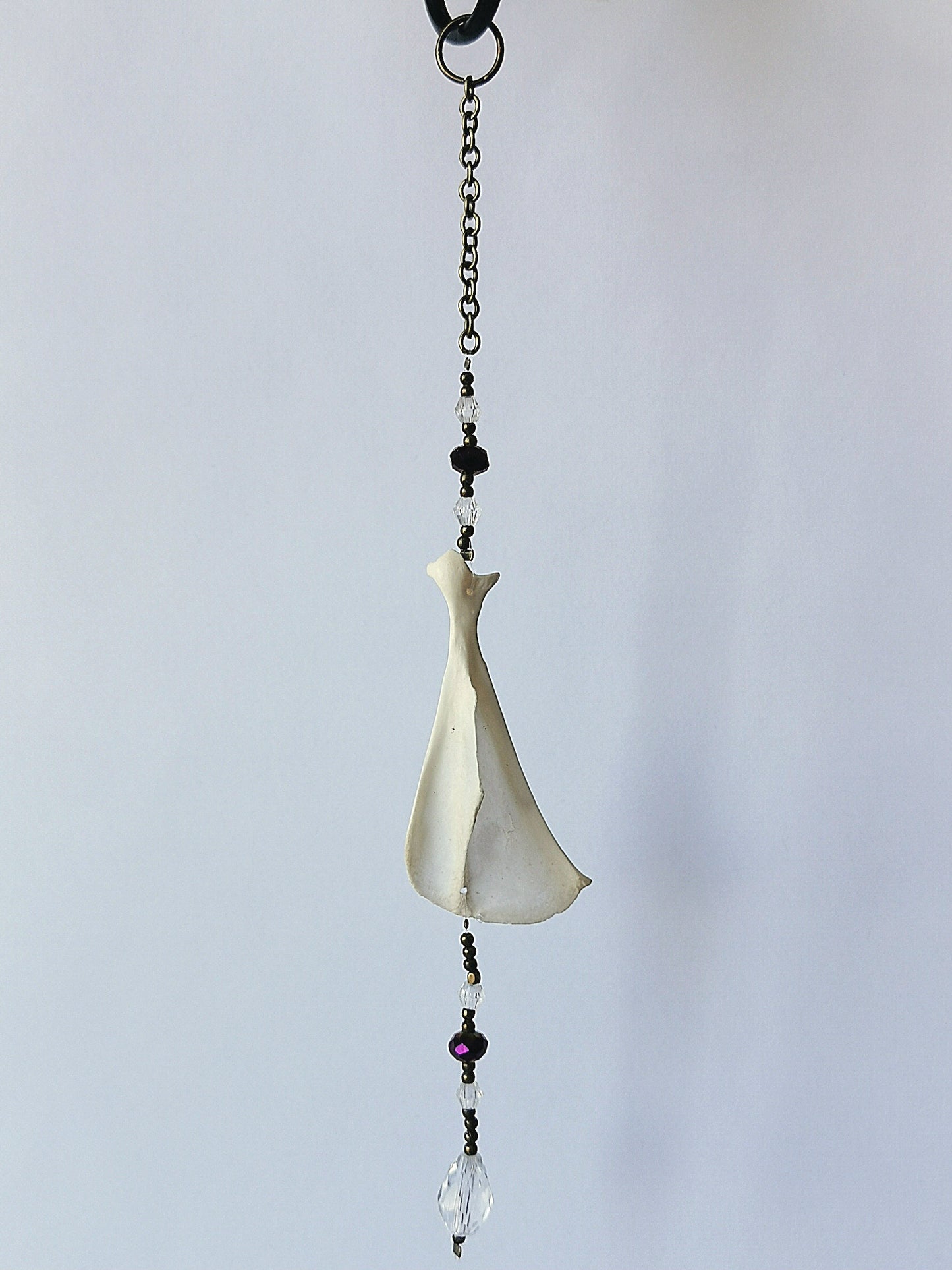 Animal bone suncatcher with clear and purple beads