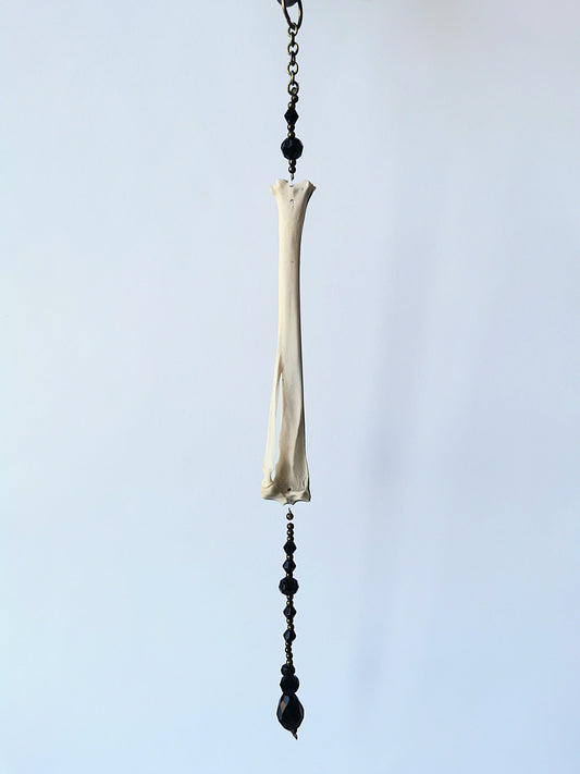 Animal bone suncatcher with black beads